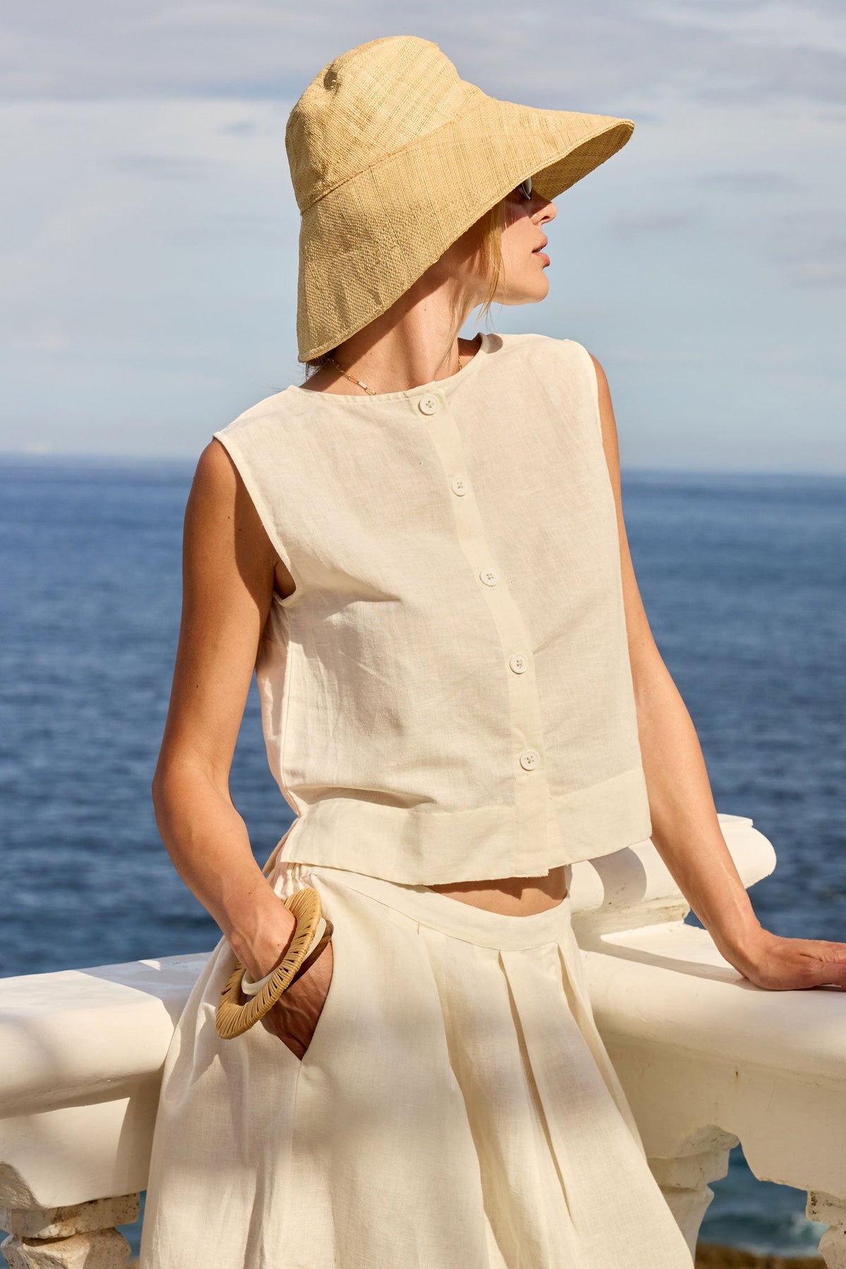 Image of a model wearing Tops. Product name - PRE SALE | LulaSoul Marissa Shell Top Ivory in Ivory colour by brand - Lulasoul