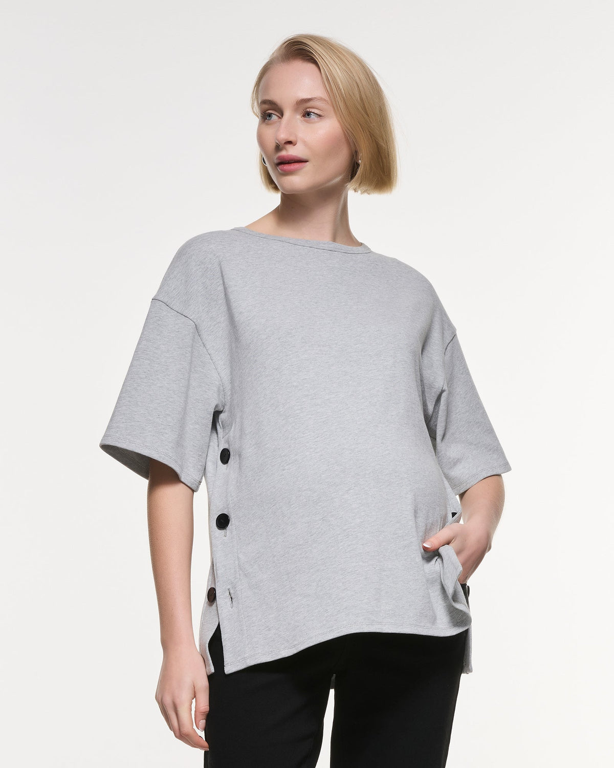 Image of a model wearing Tops. Product name - Luna Button Cotton Top in colour by brand - Soon Maternity