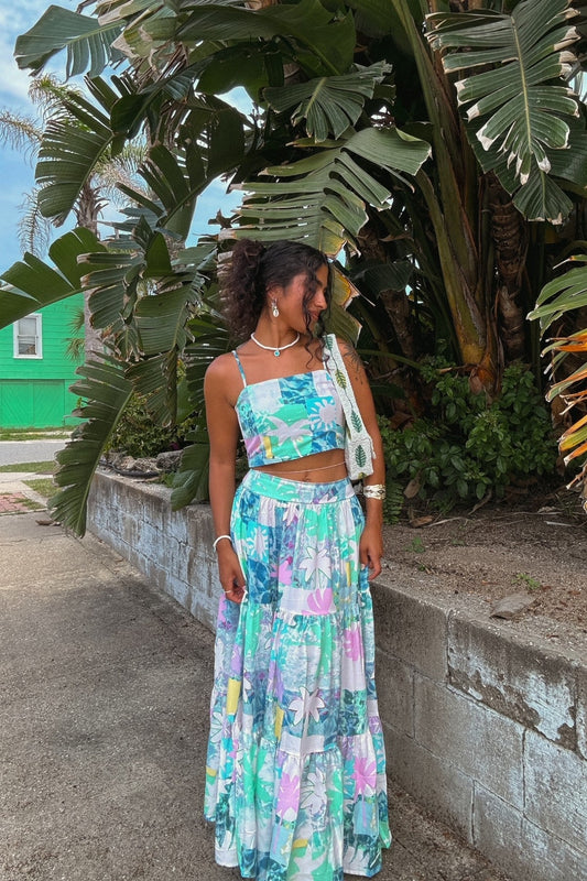 Image of a model wearing Pants. Productname: Heychic Maeve Blue Green Abstract Tiered Maxi Skirt in Aqua colour by brand - Heychic