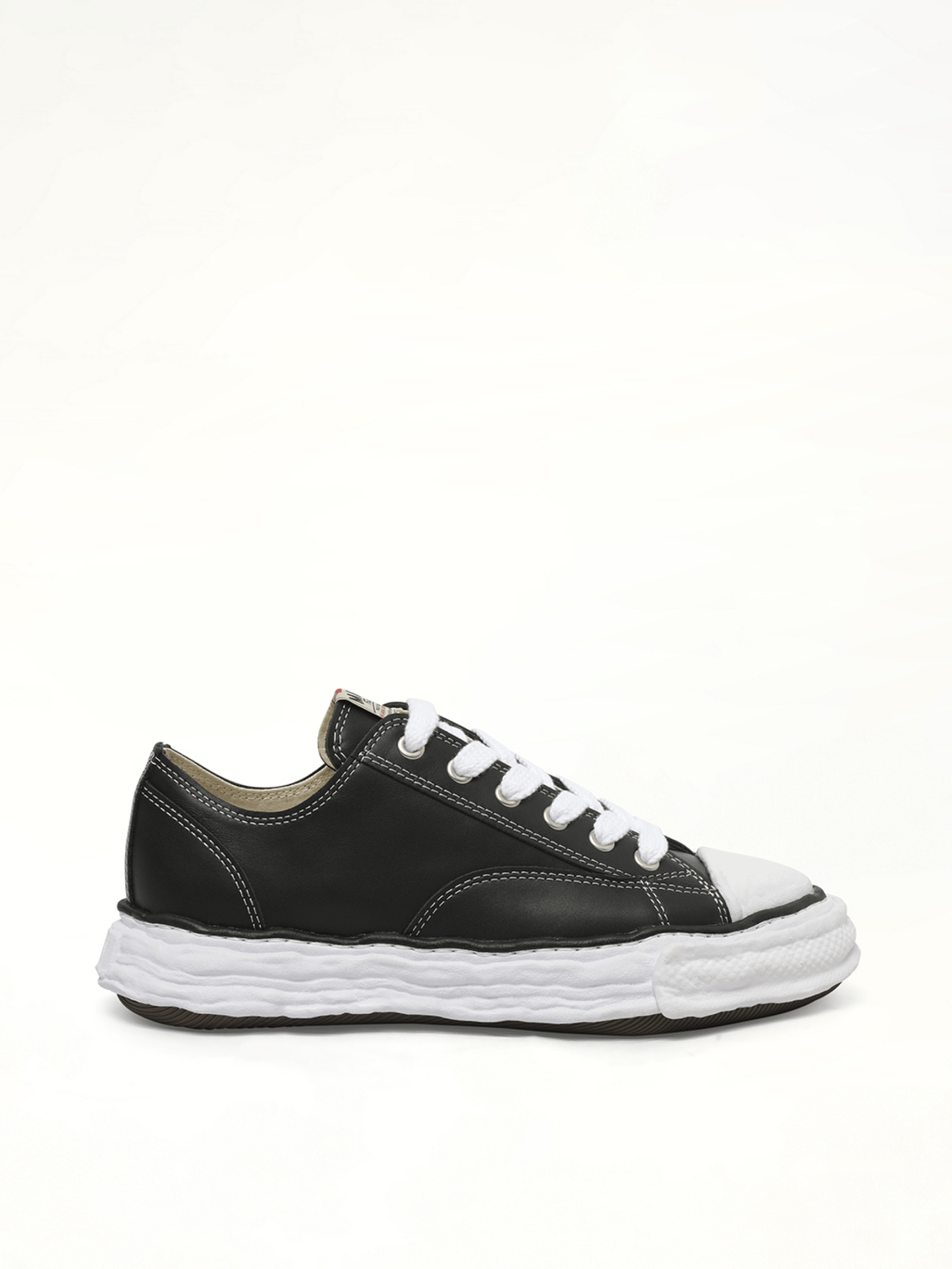 Image of Sneakers. Product name - Peterson 23 OG Low Leather Sneaker in Black colour by brand - MAISON MIHARA YASUHIRO