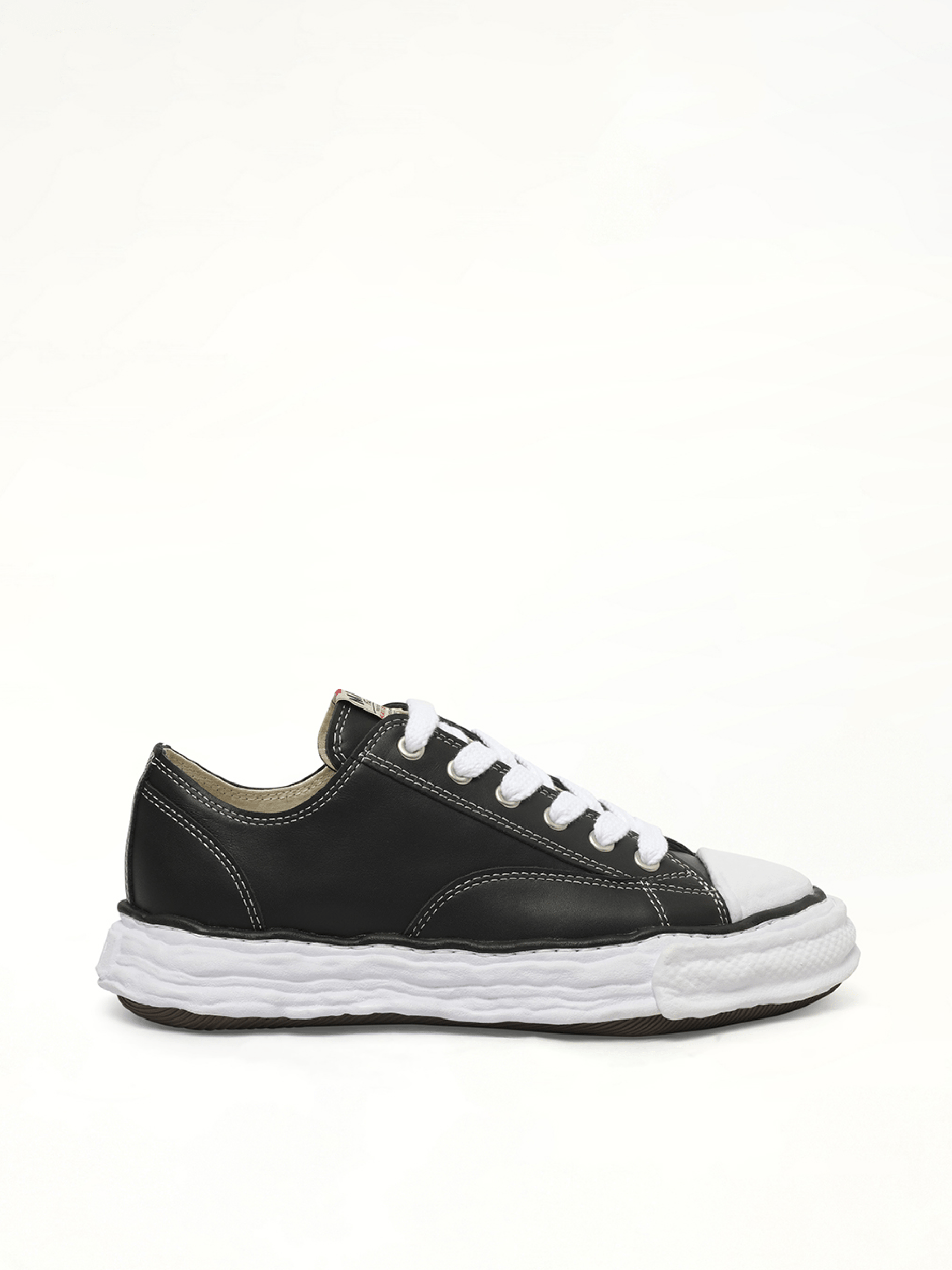 Image of Sneakers. Product name - Peterson 23 OG Low Leather Sneaker in Black colour by brand - MAISON MIHARA YASUHIRO
