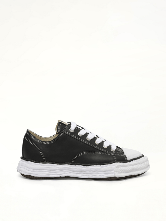 Image of Sneakers. Product name - Peterson 23 OG Low Leather Sneaker in Black colour by brand - MAISON MIHARA YASUHIRO
