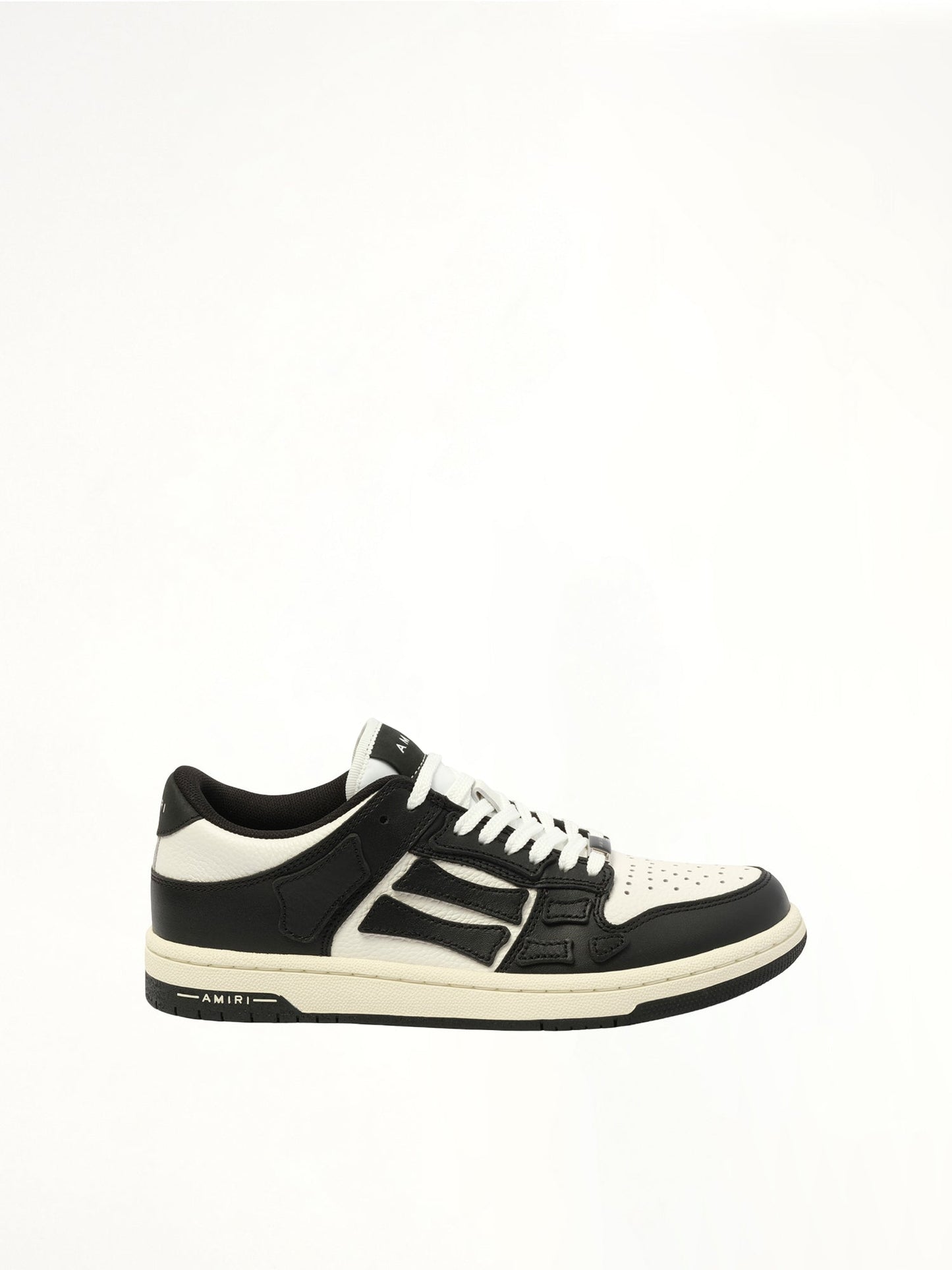 Image of Sneakers. Product name - Skeleton Top Low Sneaker in Black colour by brand - AMIRI