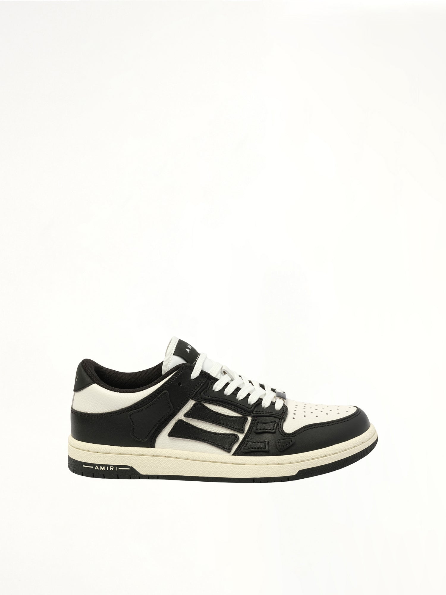 Image of Sneakers. Product name - Skeleton Top Low Sneaker in Black colour by brand - AMIRI