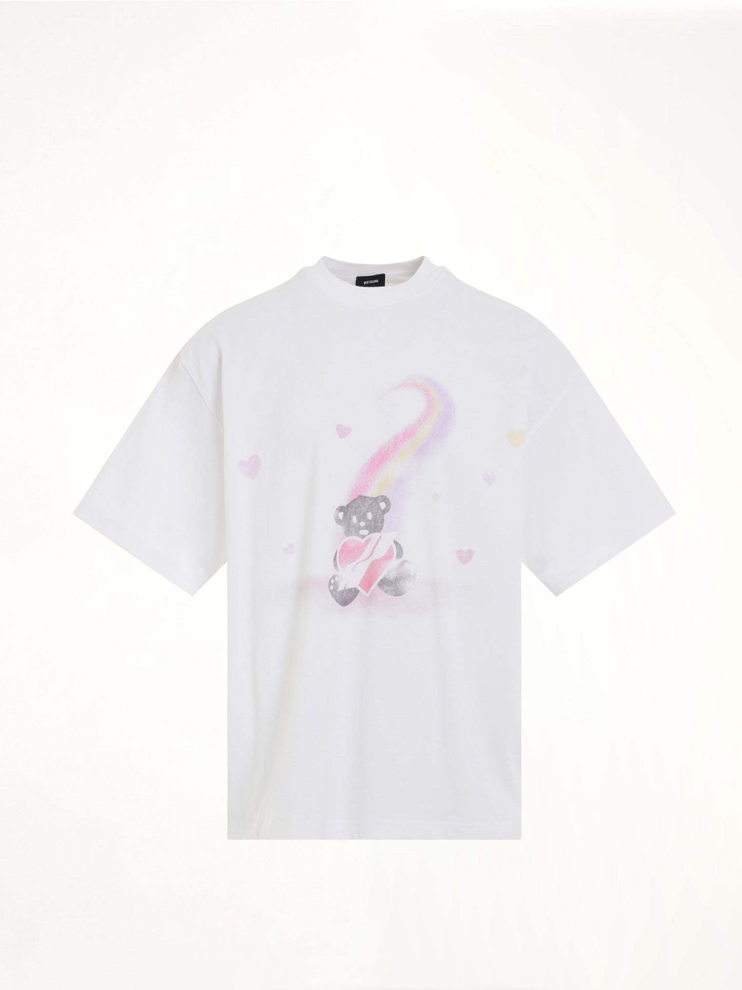 Image of a model wearing Tops. Productname: WE11DONE Teddy Bear Print T-Shirt in White colour by brand - WE11DONE