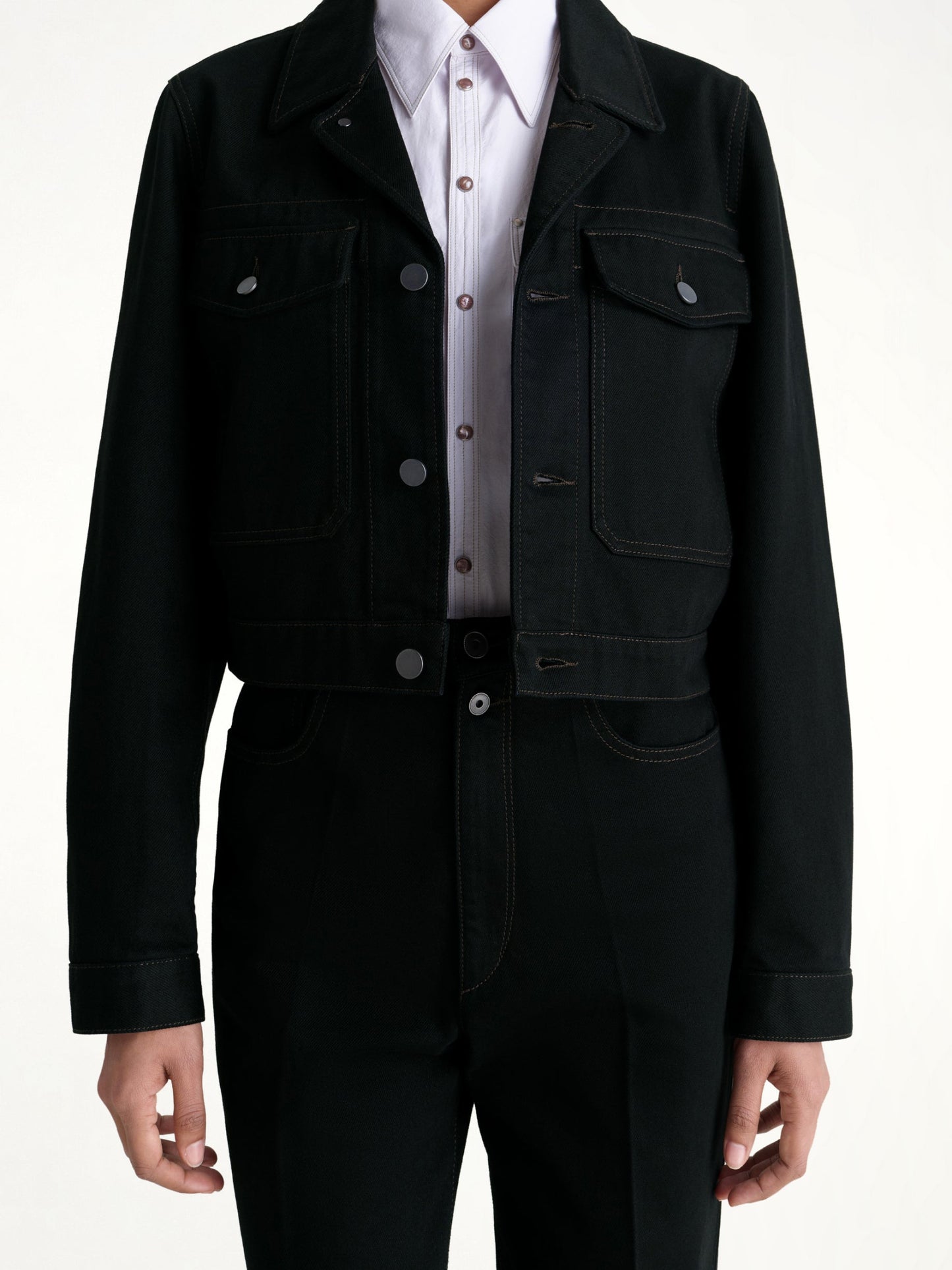 Image of a model wearing Outerwear. Productname: LEMAIRE Cropped Blouson in Black colour by brand - LEMAIRE