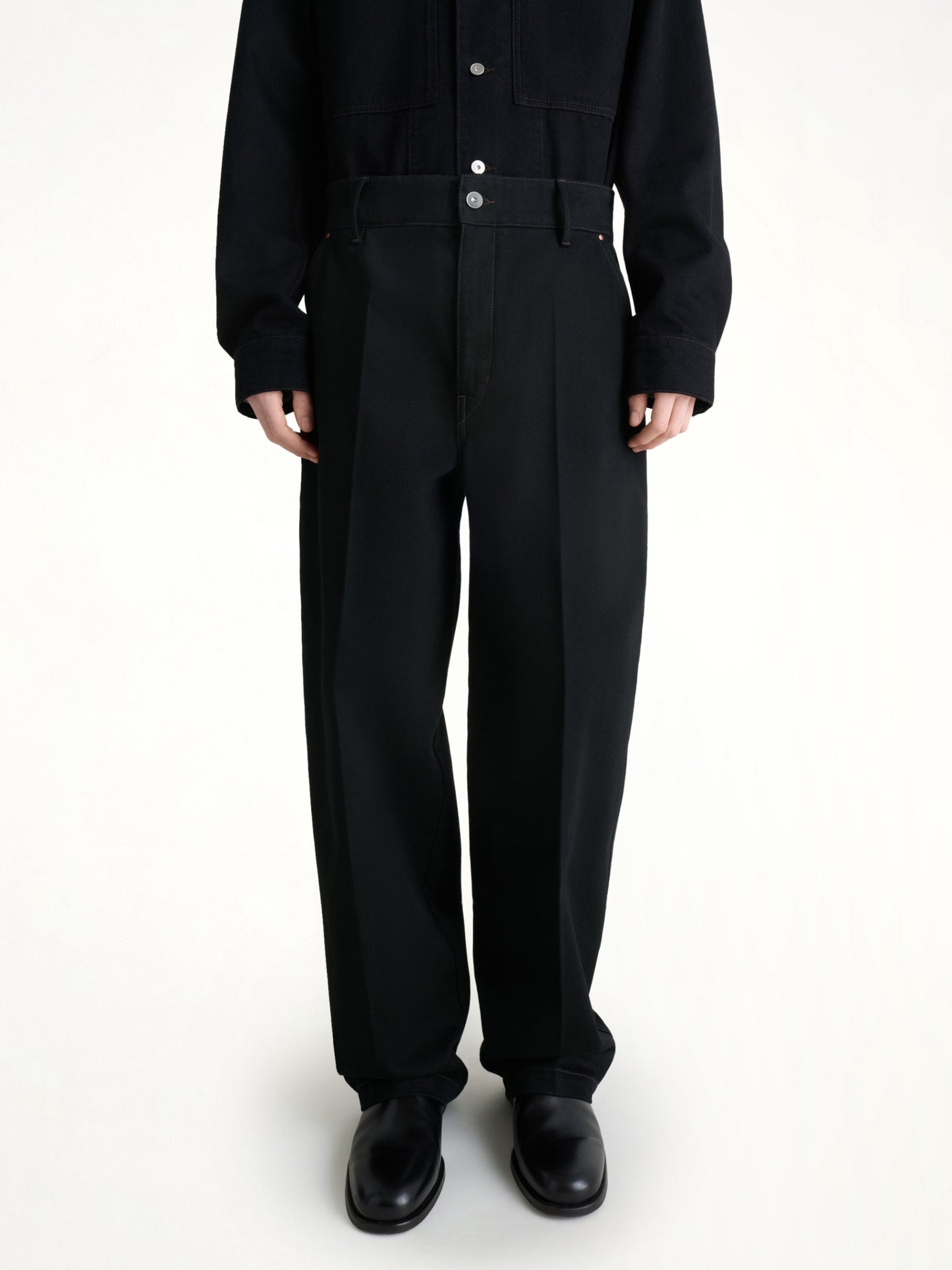 Image of a model wearing Uniforms & Workwear. Productname: LEMAIRE Maxi Barrel Workwear Pants in Black colour by brand - LEMAIRE