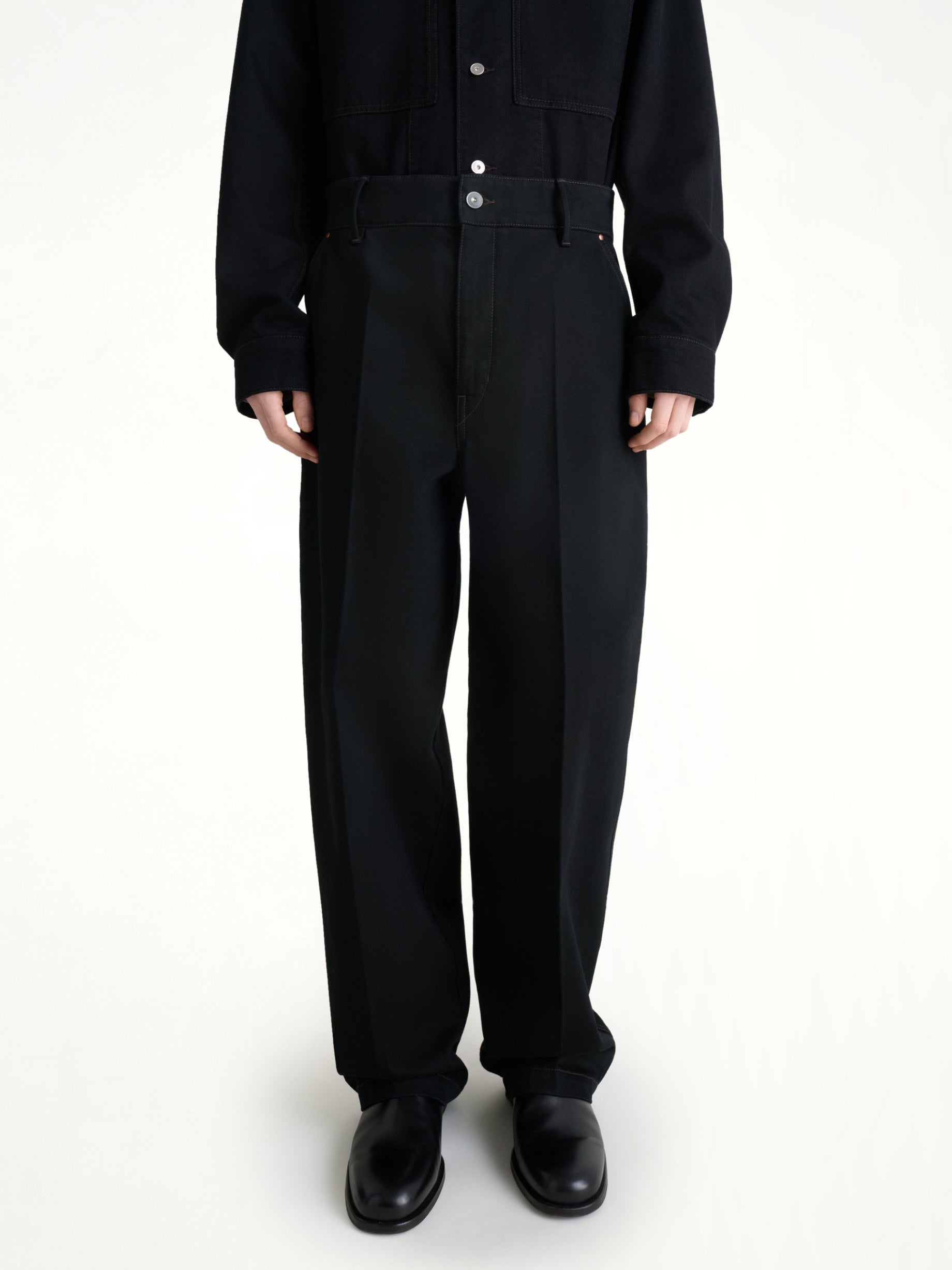 Image of a model wearing Uniforms & Workwear. Productname: LEMAIRE Maxi Barrel Workwear Pants in Black colour by brand - LEMAIRE