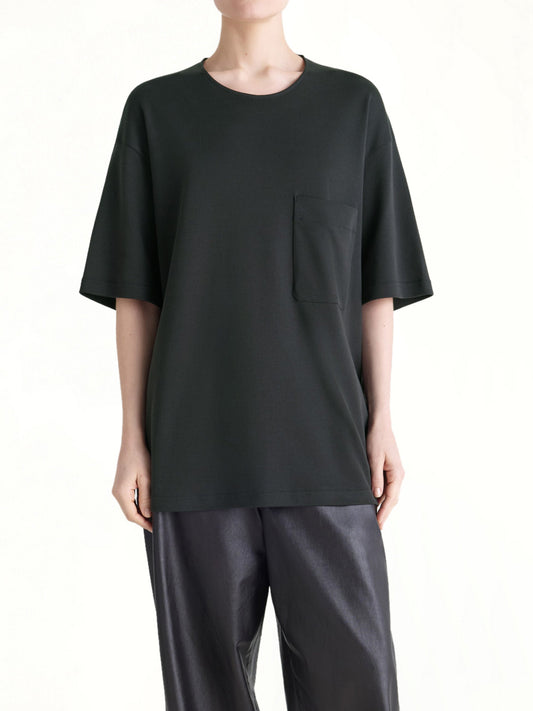 Image of a model wearing Tops. Productname: LEMAIRE Relaxed Fit T-Shirt in Black colour by brand - LEMAIRE
