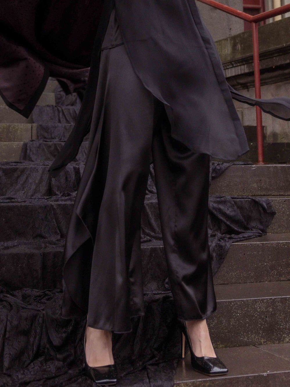 Image of a model wearing Pants. Product name - M.A Dainty Mcgehee Pant in Black colour by brand - M.A Dainty