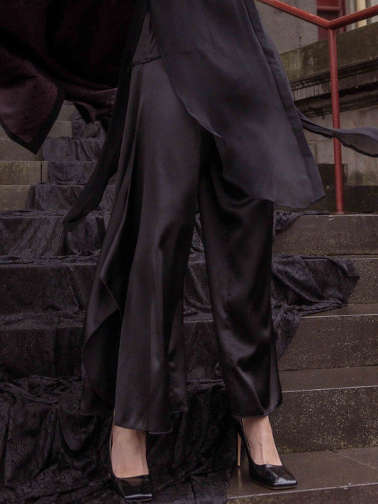 Image of a model wearing Pants. Product name - M.A Dainty Mcgehee Pant in Black colour by brand - M.A Dainty