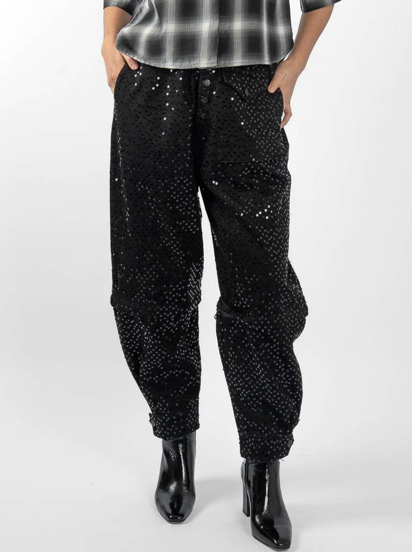 Image of a model wearing Pants. Product name - M.A Dainty Sequin Trucker in Black Sequin colour by brand - M.A Dainty