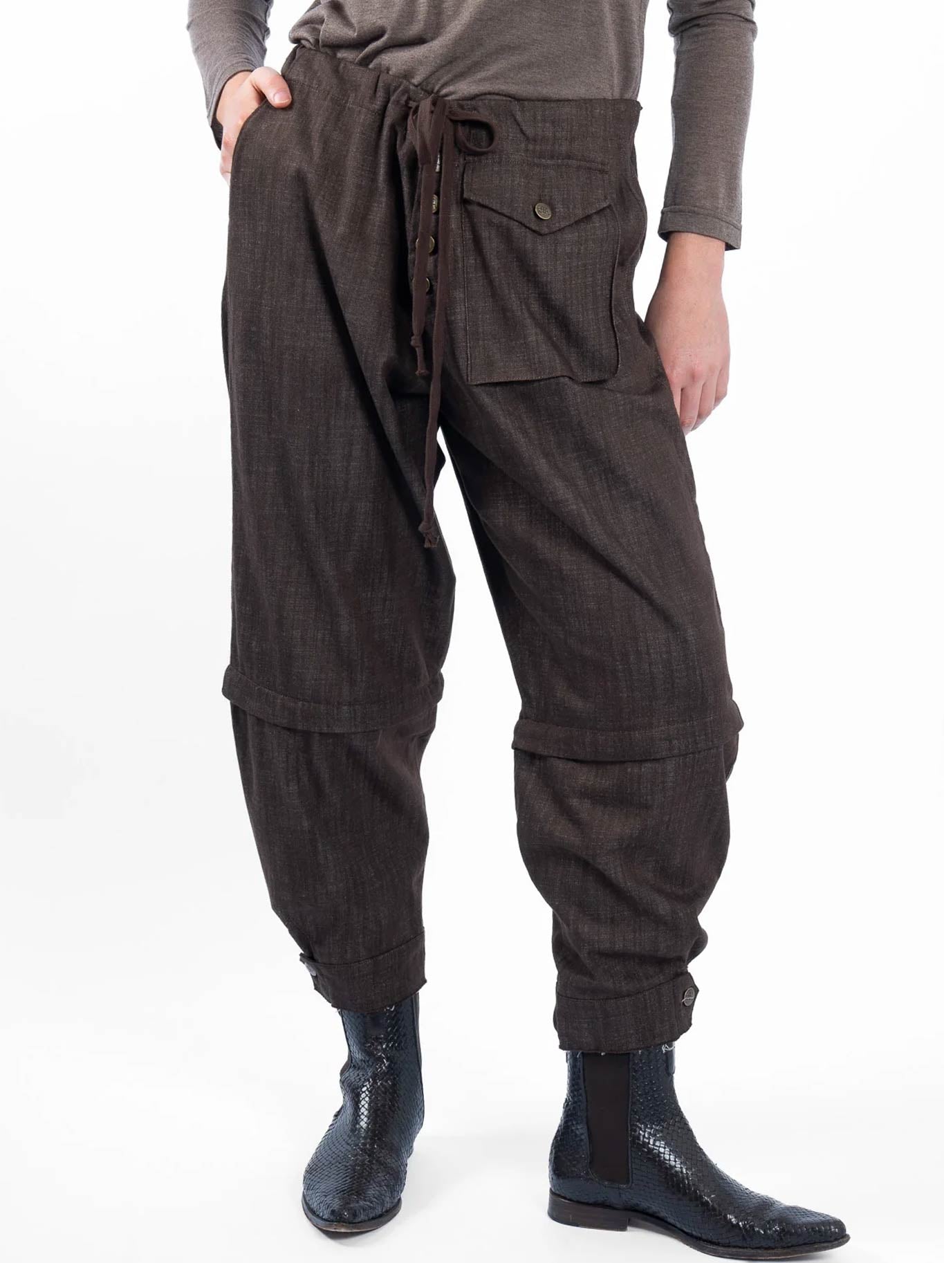 Image of a model wearing Pants. Product name - M.A Dainty Trucker Pant in Chocolate colour by brand - M.A Dainty