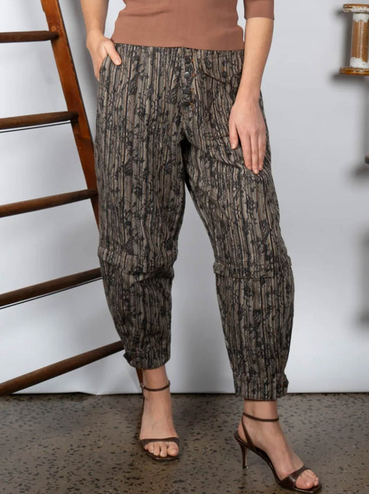 Image of a model wearing Pants. Product name - M.A Dainty Trucker Pant in Pressed Flowers colour by brand - M.A Dainty