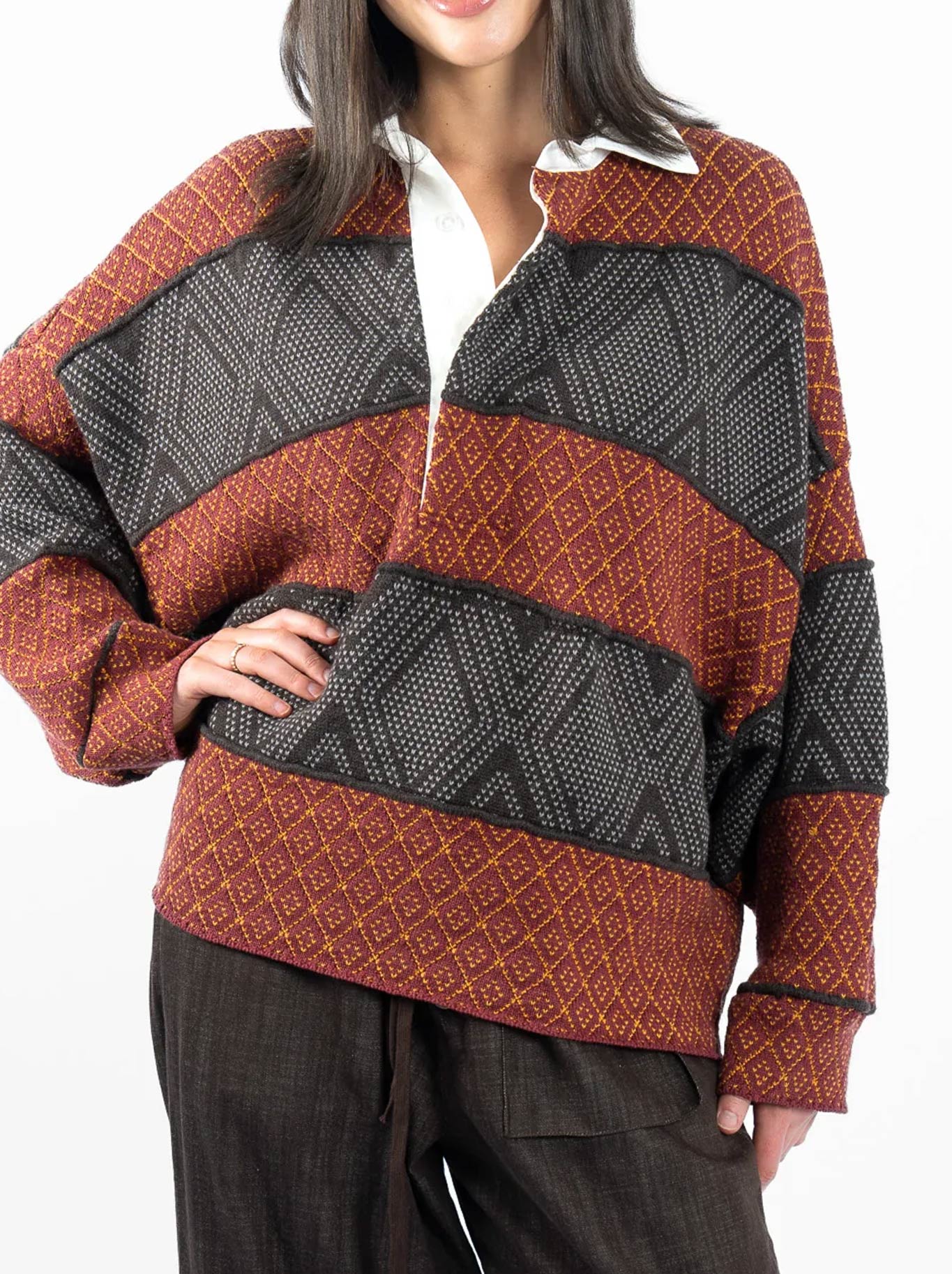 Image of a model wearing Tops. Product name - M.A Dainty Flank Rugby Knit in Rusty Rugby colour by brand - M.A Dainty