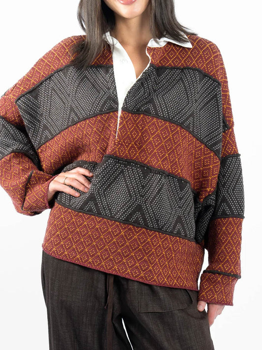 Image of a model wearing Tops. Product name - M.A Dainty Flank Rugby Knit in Rusty Rugby colour by brand - M.A Dainty