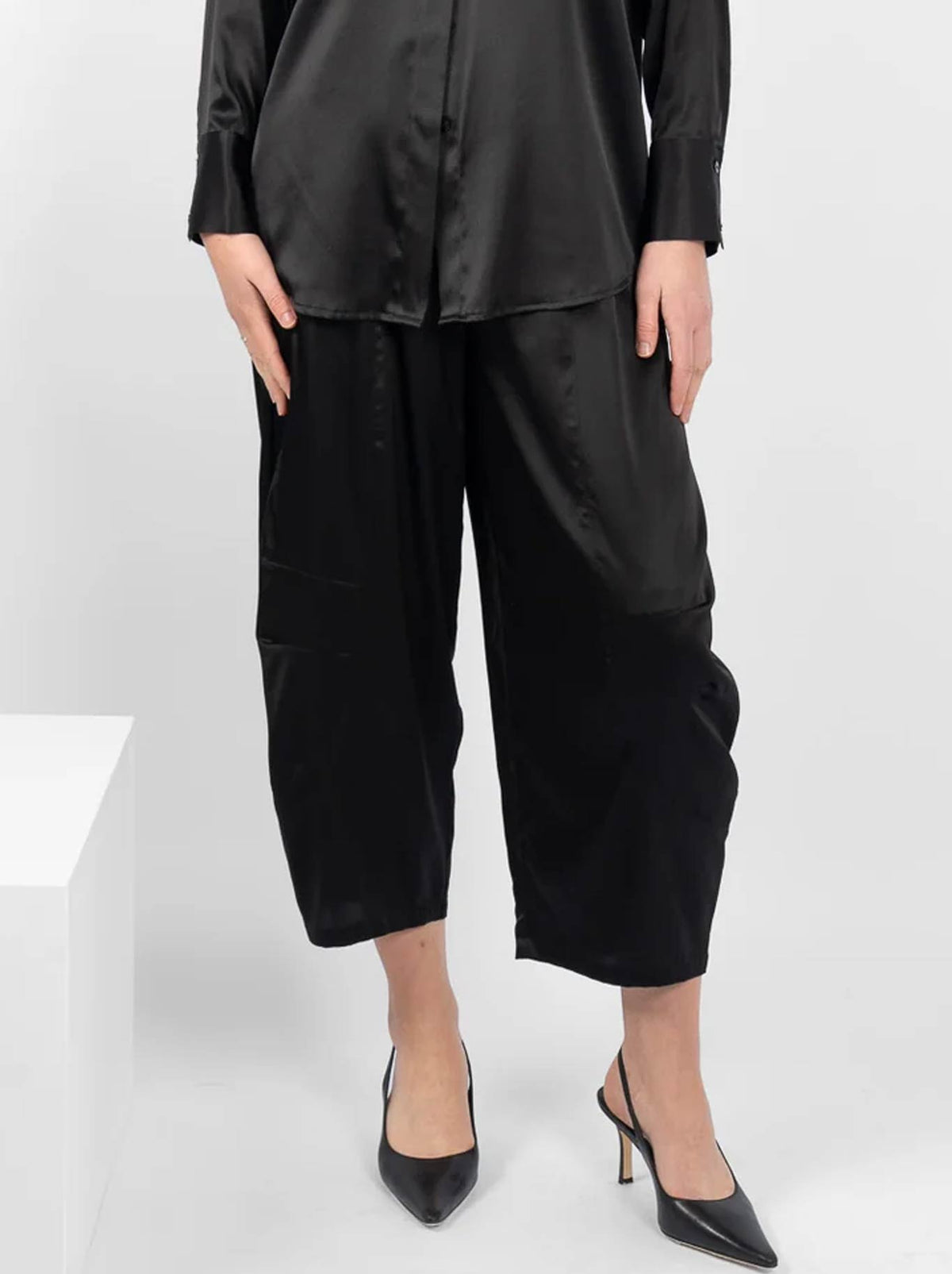 Image of a model wearing Pants. Product name - M.A Dainty Niko Pant in Black colour by brand - M.A Dainty