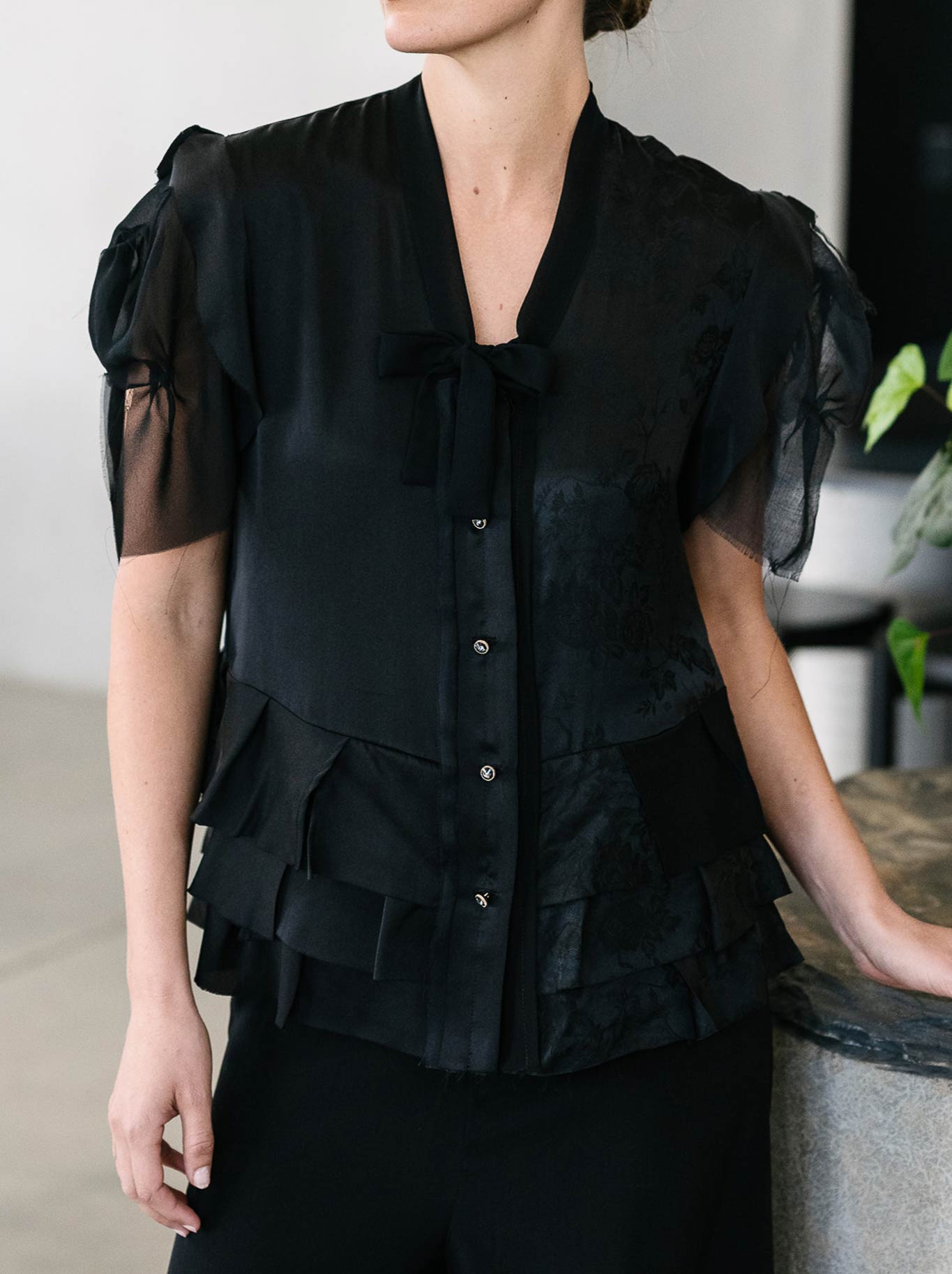 Image of a model wearing Tops. Productname: M.A Dainty Maggie Top in Black colour by brand - M.A Dainty