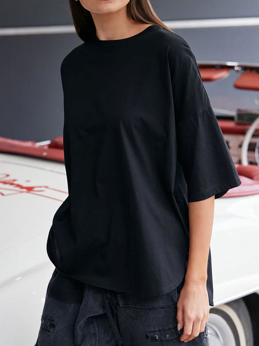 Image of a model wearing Tops. Productname: M.A DAINTY PEONY TEE in Black colour by brand - M.A Dainty