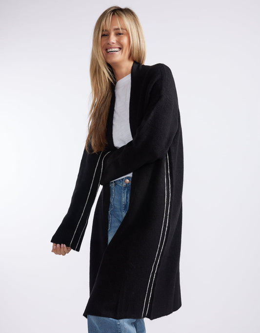 Image of a model wearing Outerwear. Product name - Montreux Wool Alpaca Longline Cardigan Black in Black colour by brand - White & Co.