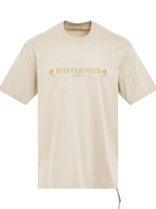 Image of a model wearing Tops. Productname: MASTERMIND Brilliant Logo T-Shirt in BEIGE colour by brand - MASTERMIND