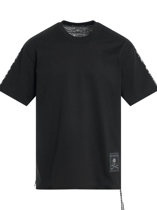 Image of a model wearing Tops. Productname: MASTERMIND Switched Ethnic Border T-Shirt in BLACK colour by brand - MASTERMIND