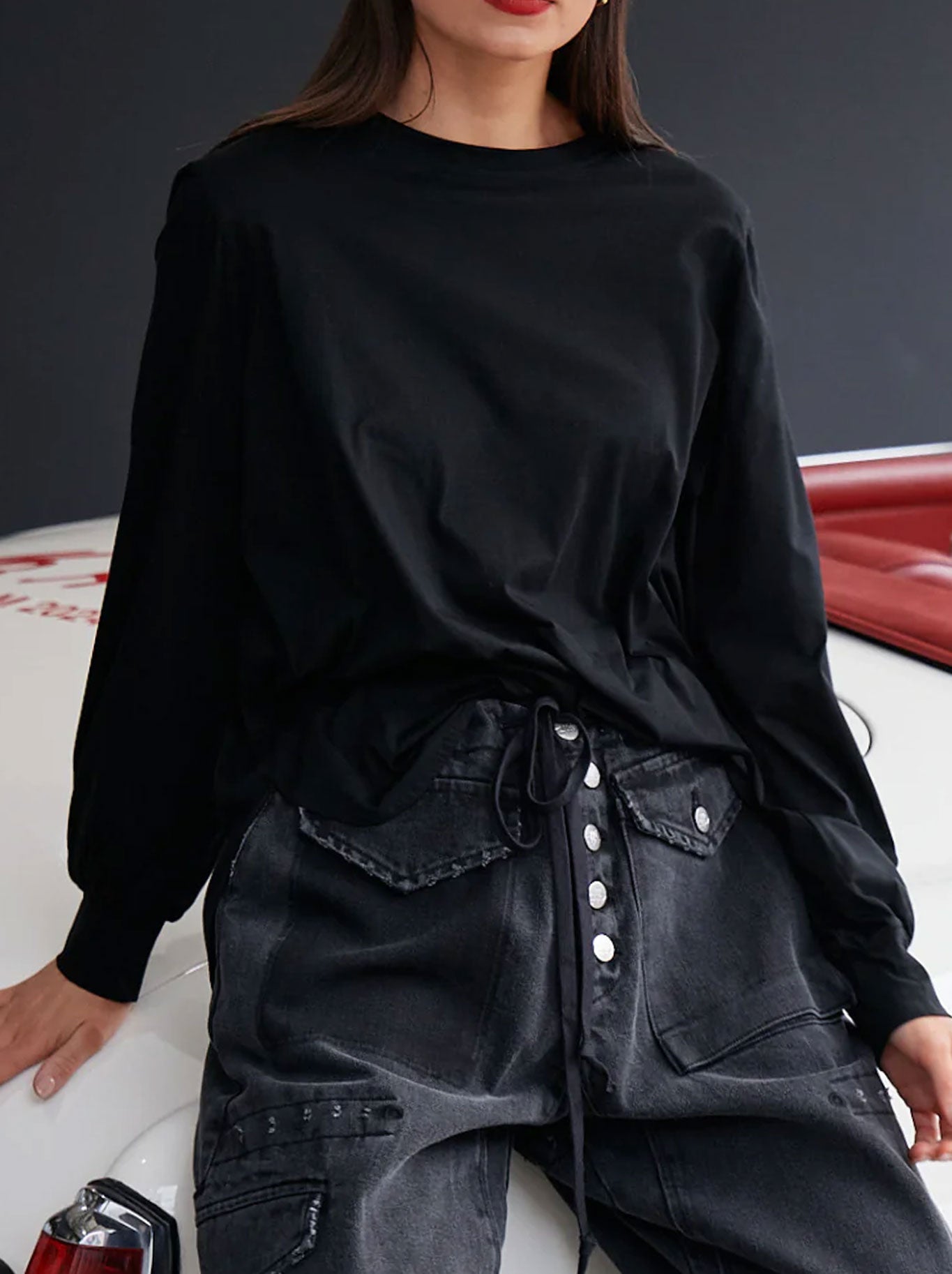 Image of a model wearing Tops. Product name - M.A Dainty Baxter Top in Black colour by brand - M.A Dainty