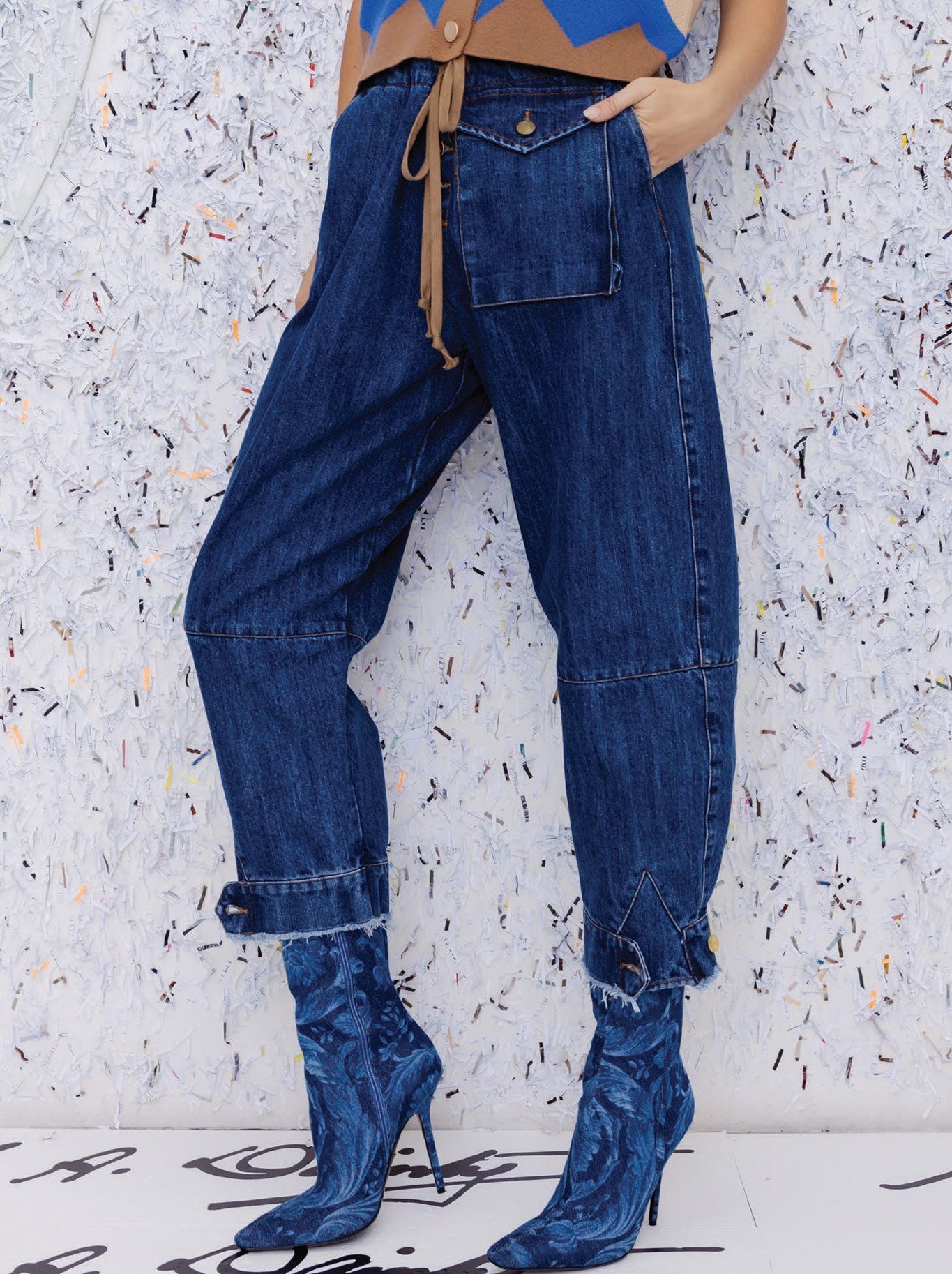 Image of a model wearing Pants. Productname: M.A DAINTY TRUCKER JEAN in Denim colour by brand - M.A Dainty