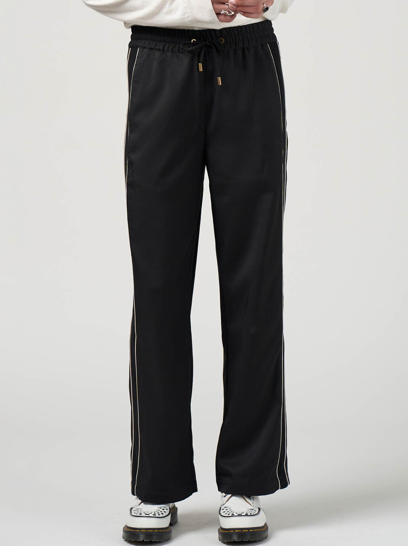 Image of a model wearing Pants. Productname: Madly Sweetly Tactical Pant in Black colour by brand - Madly Sweetly