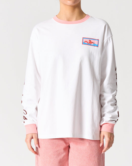 Image of a model wearing Tops. Product name - Malibu Long Sleeve Tee in Belluno Veneto colour by brand - Walnut Melbourne