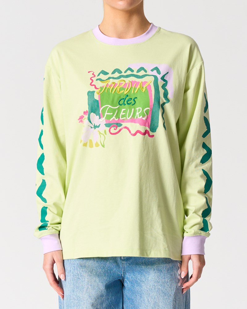 Image of a model wearing Tops. Product name - Malibu Long Sleeve Tee in Jarden De Fleur colour by brand - Walnut Melbourne