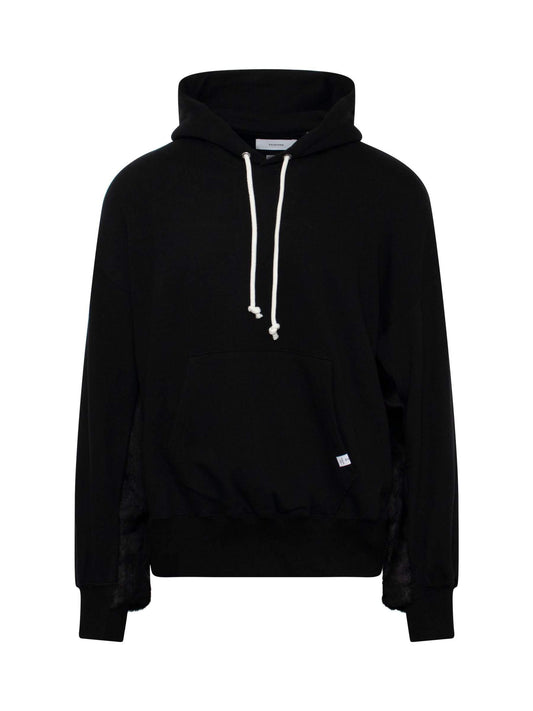 Image of a model wearing Outerwear. Productname: FACETASM Faux Fur Hoodie in BLACK colour by brand - FACETASM