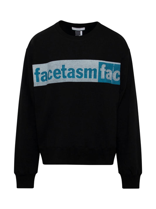 Image of a model wearing Outerwear. Productname: FACETASM Logo Print Xxl Sweat in BLACK colour by brand - FACETASM