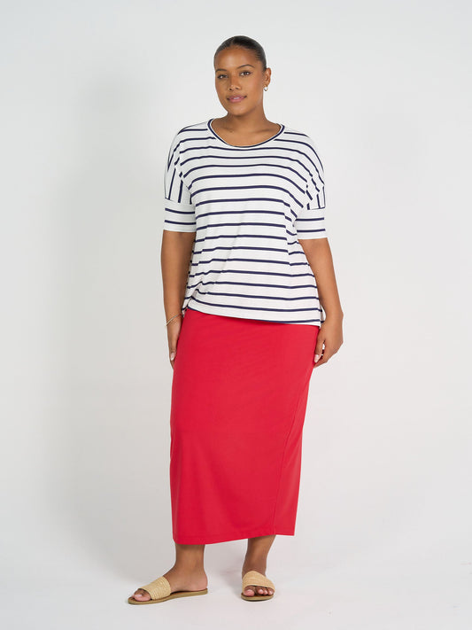 Image of a model wearing Skirts. Product name - Maxi Bamboo Whitney Tube Skirt Lipstick in Lipstick colour by brand - Lou Lou