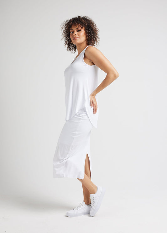 Image of a model wearing Skirts. Product name - Maxi Bamboo Whitney Tube Skirt White in White colour by brand - Lou Lou