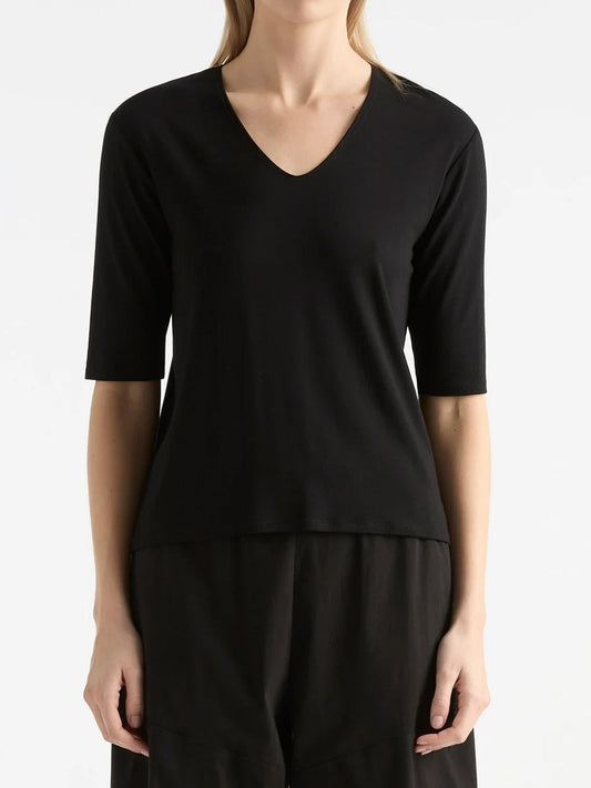 Image of a model wearing Tops. Productname: MELA PURDIE ELBOW TOP in Black colour by brand - Mela Purdie