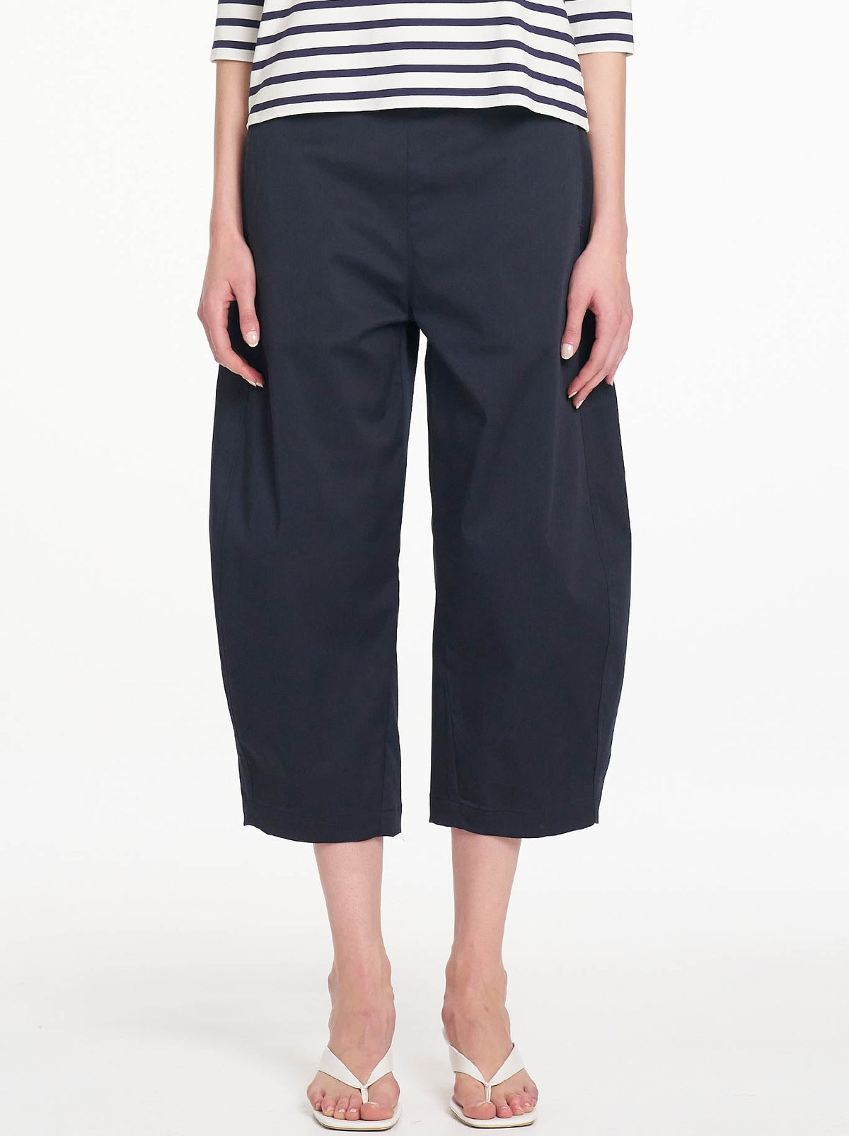 Image of a model wearing Pants. Product name - Mela Purdie Crop Barrel Pant in Navy colour by brand - Mela Purdie