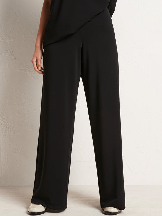 Image of a model wearing Pants. Productname: MELA PURDIE PALAZZO PANT in Black colour by brand - Mela Purdie