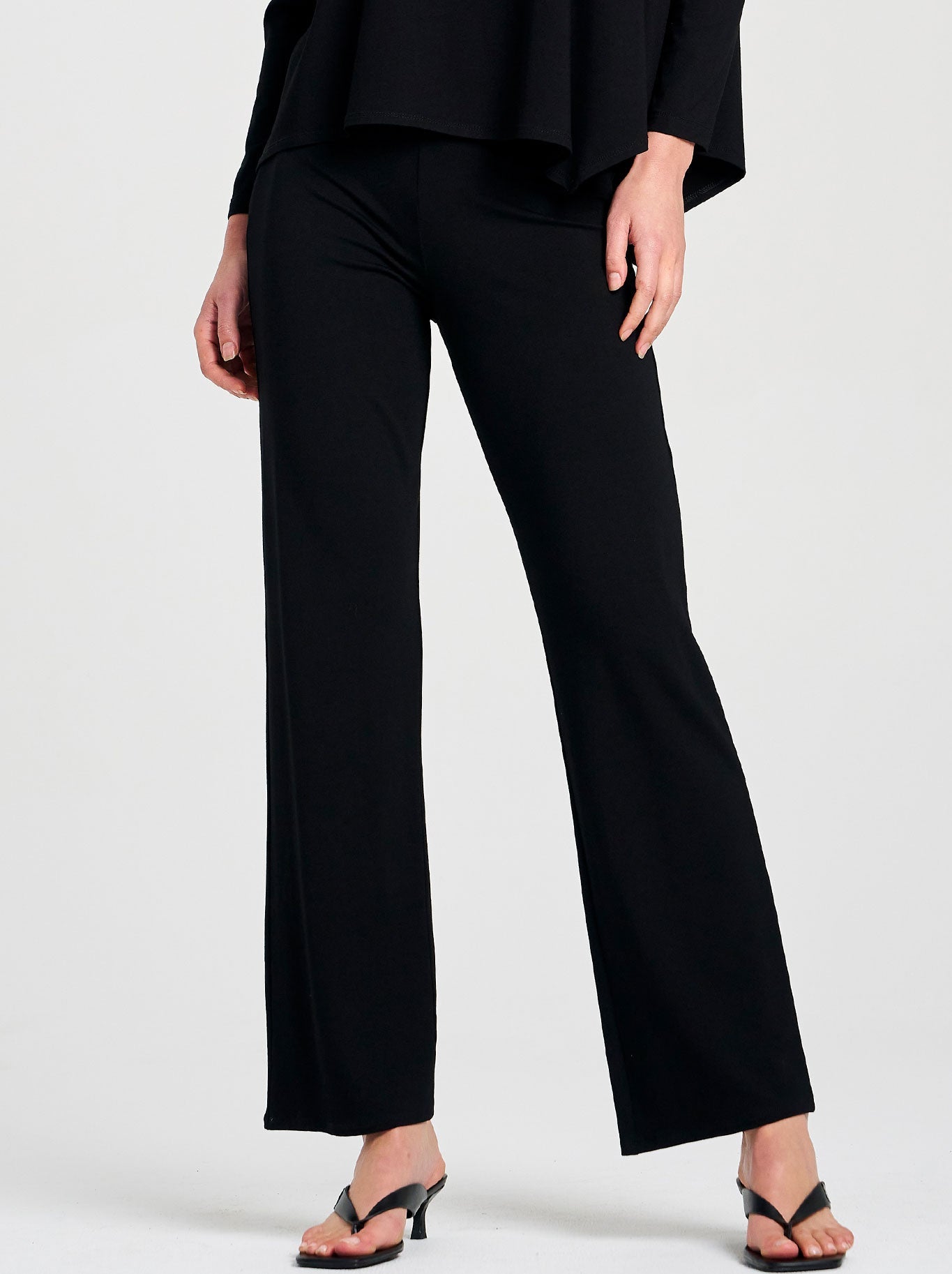 Image of a model wearing Pants. Product name - Mela Purdie Long Pant in Black colour by brand - Mela Purdie