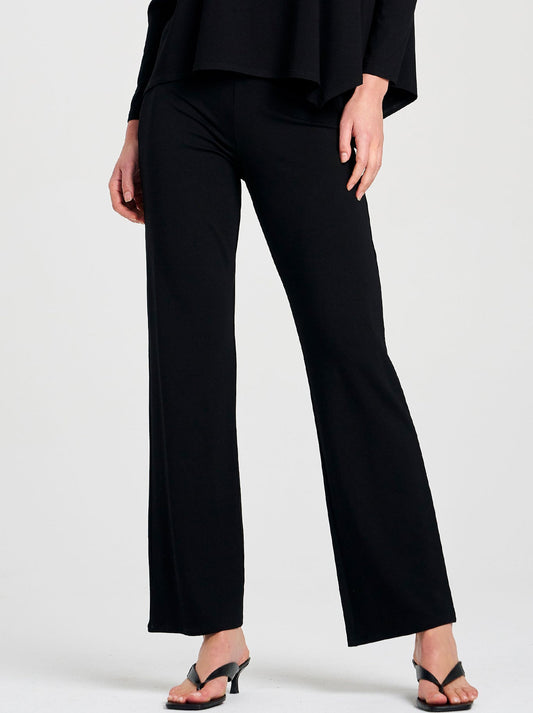 Image of a model wearing Pants. Product name - Mela Purdie Long Pant in Black colour by brand - Mela Purdie