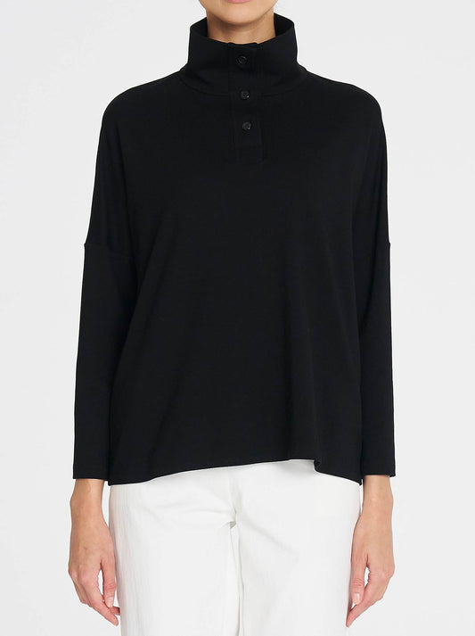 Image of a model wearing Outerwear. Productname: Mela Purdie Tab Sweater in Black colour by brand - Mela Purdie