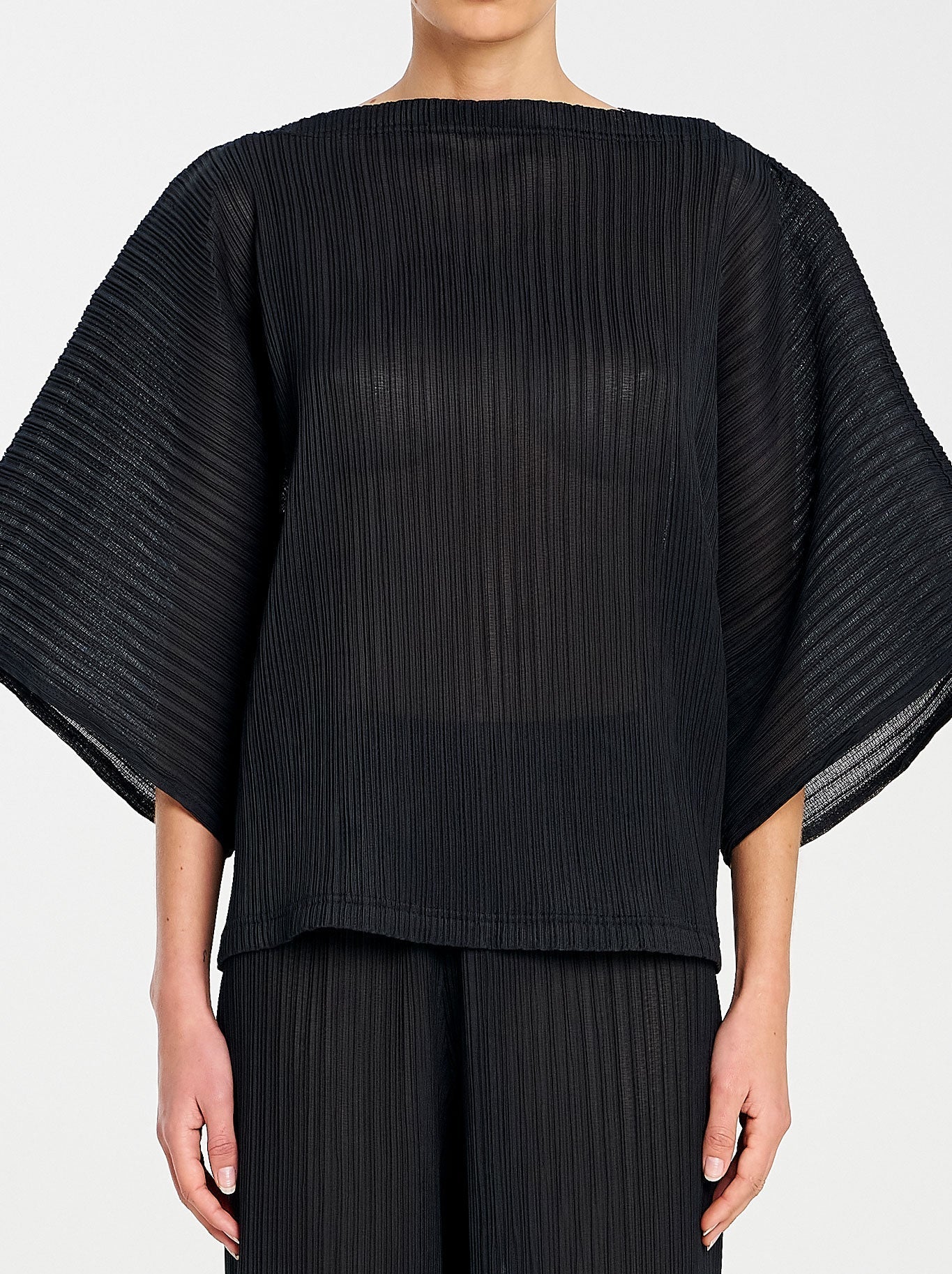 Image of a model wearing Tops. Productname: MELA PURDIE MISO SHELL in Black colour by brand - Mela Purdie
