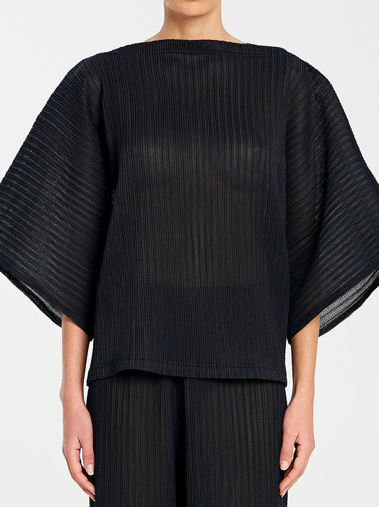 Image of a model wearing Tops. Productname: MELA PURDIE MISO SHELL in Black colour by brand - Mela Purdie