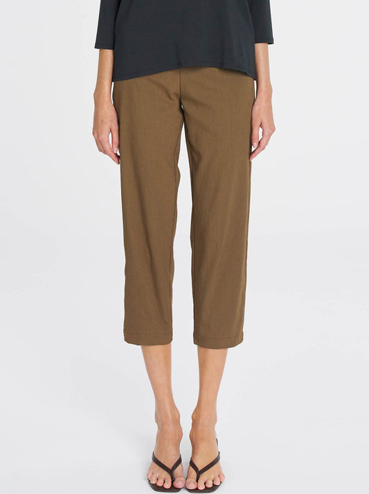Image of a model wearing Pants. Product name - Mela Purdie Tapered Flat Pant in Tannin colour by brand - Mela Purdie