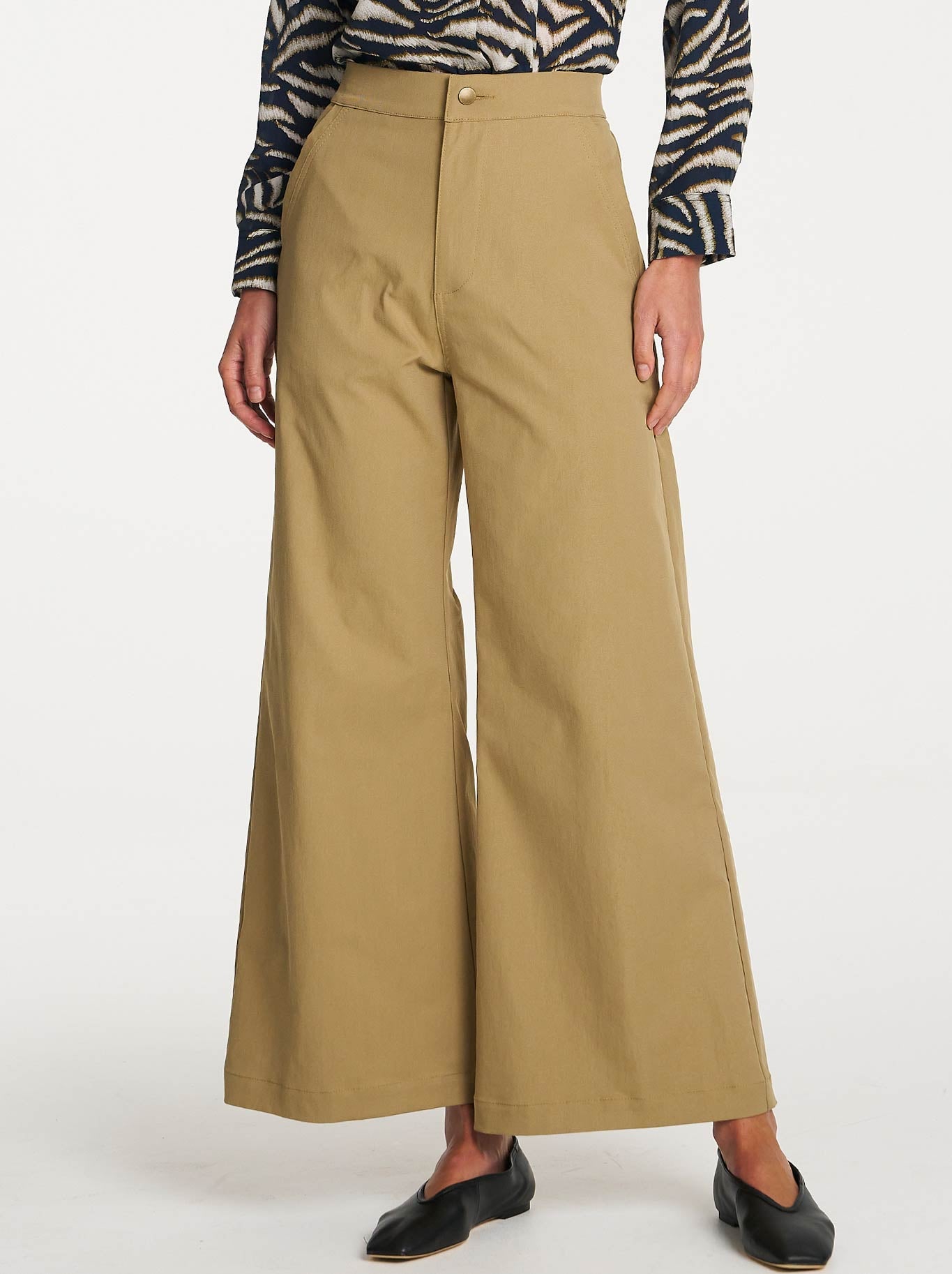 Image of a model wearing Pants. Product name - Mela Purdie Travel Pant in Trench colour by brand - Mela Purdie
