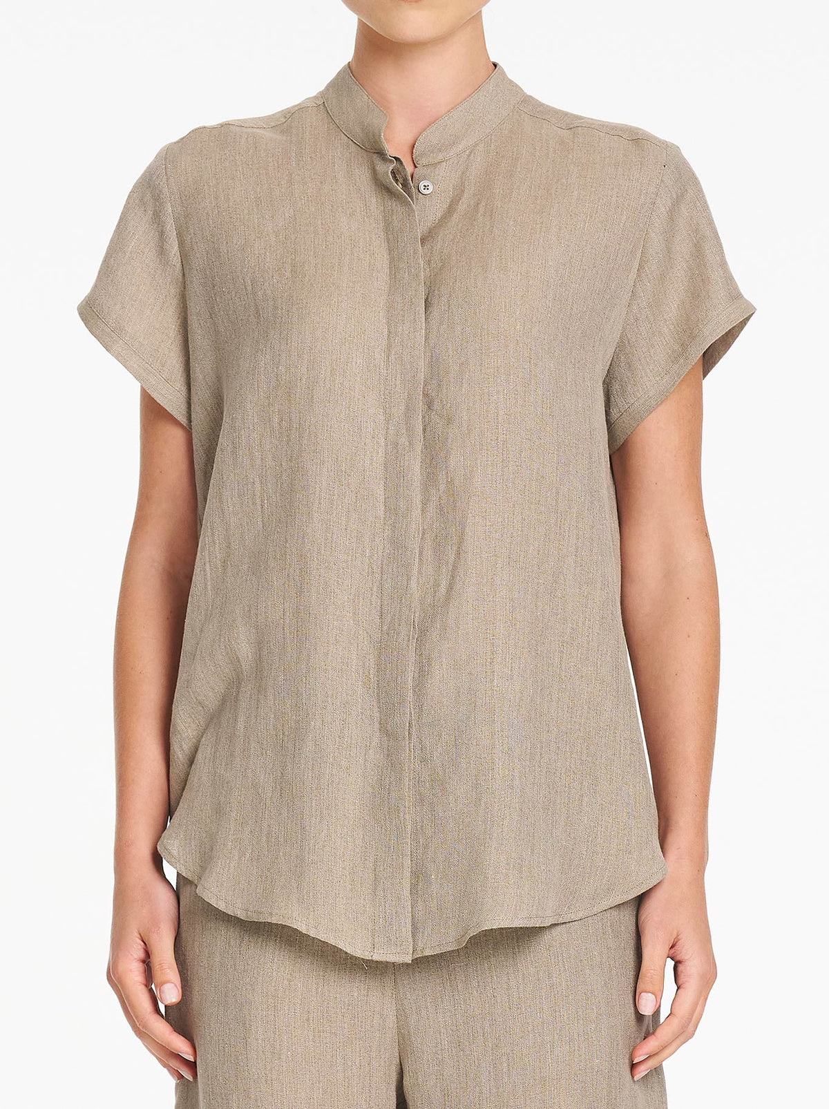 Image of a model wearing Tops. Product name - Mela Purdie Stand Shirt in Stucco colour by brand - Mela Purdie