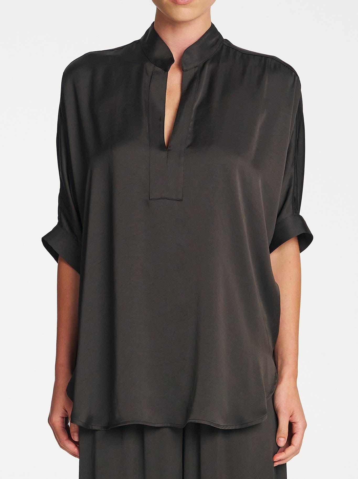 Image of a model wearing Tops. Product name - Mela Purdie Villa Tabbard in Mink colour by brand - Mela Purdie