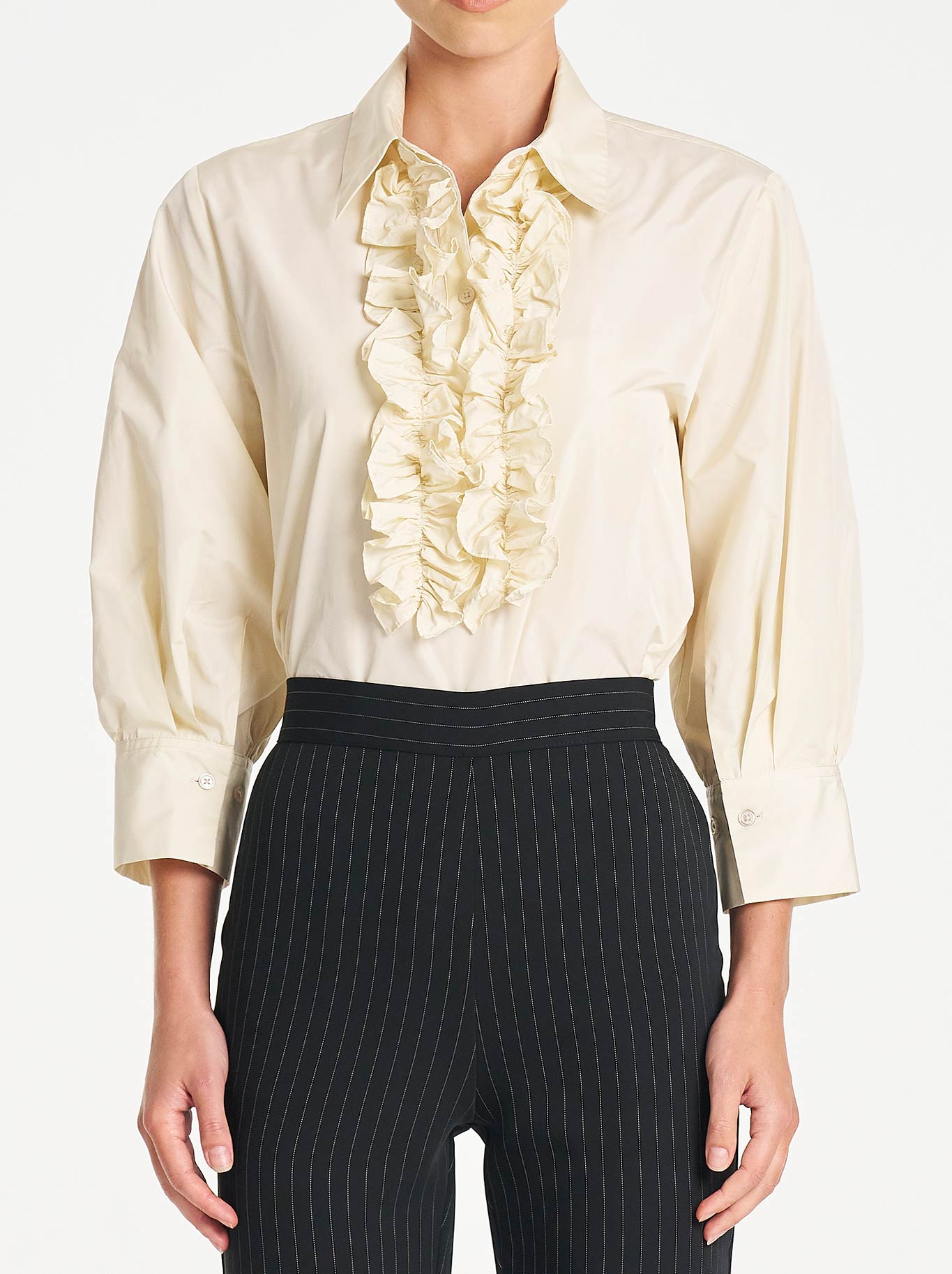 Image of a model wearing Tops. Product name - Mela Purdie Ruffle Resort Top in Vanilla colour by brand - Mela Purdie