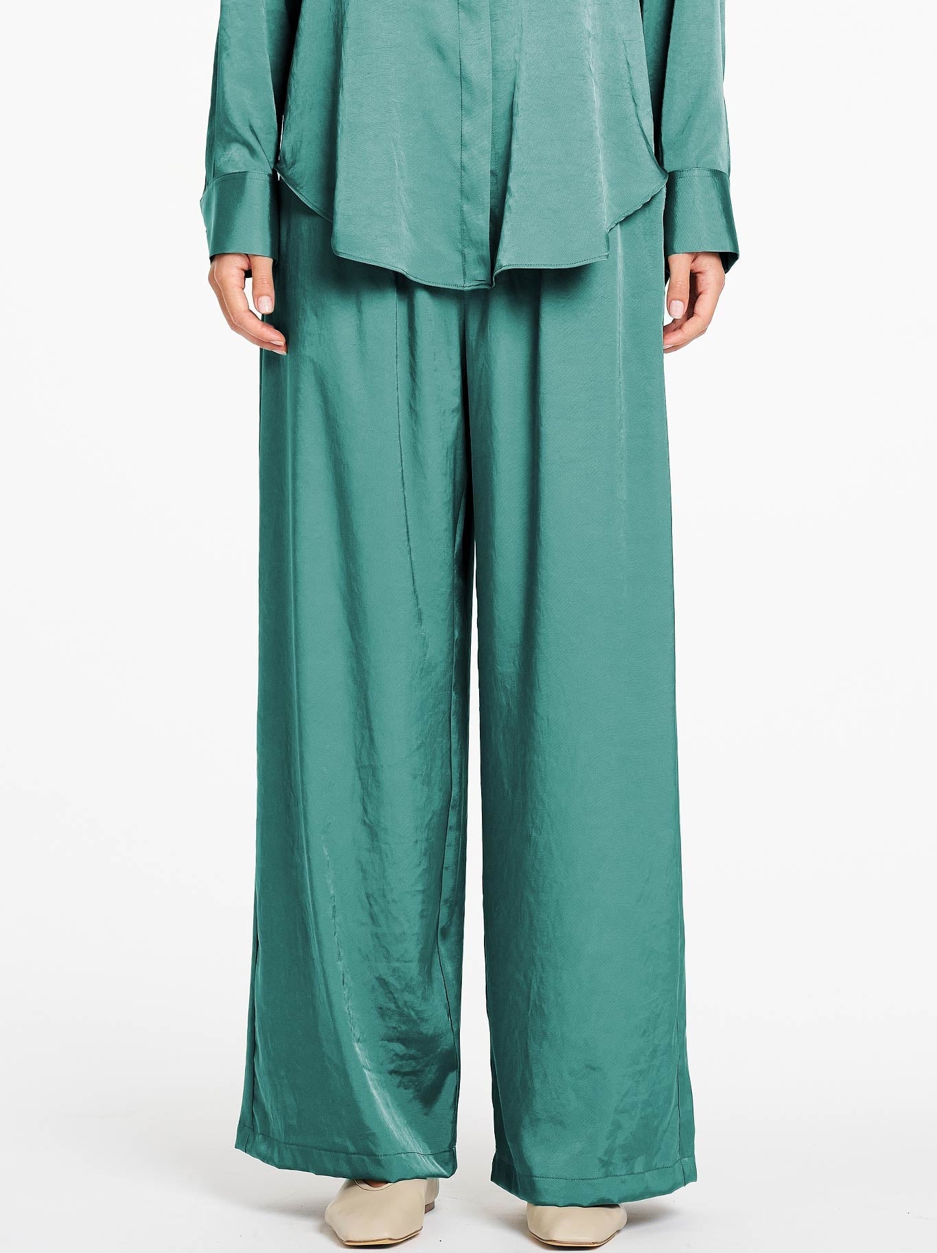 Image of a model wearing Pants. Product name - Mela Purdie Maxi Pace Pant in Verdant colour by brand - Mela Purdie