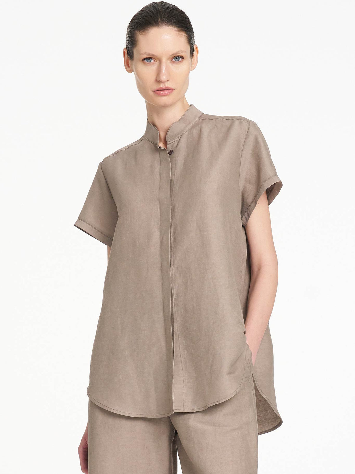 Image of a model wearing Tops. Product name - Mela Purdie Stand Shirt in Twig colour by brand - Mela Purdie